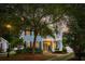Two story home with a double porch, classic curb appeal, and mature trees at 2900 Split Hickory Ct, Johns Island, SC 29455