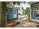 Exterior view showing the blue siding, yard, and a glimpse of surrounding neighborhood homes at 2900 Split Hickory Ct, Johns Island, SC 29455