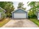 Detached one-car garage with a white door and a concrete driveway at 2900 Split Hickory Ct, Johns Island, SC 29455