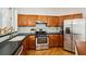 Kitchen featuring stainless steel appliances, dark countertops and wood cabinetry at 2900 Split Hickory Ct, Johns Island, SC 29455