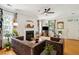 Well-lit living room with fireplace, hardwood floors, and tastefully coordinated decor at 2900 Split Hickory Ct, Johns Island, SC 29455