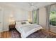 Cozy bedroom with hardwood floors, patterned rug, and bright natural light at 2900 Split Hickory Ct, Johns Island, SC 29455