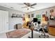 Spacious home office with hardwood floors, guitars on the wall, and lots of space to work at 2900 Split Hickory Ct, Johns Island, SC 29455