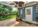 Covered patio with a ceiling fan, white door, and view of the fenced backyard at 2900 Split Hickory Ct, Johns Island, SC 29455
