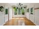 Bright sunroom filled with natural light, hardwood floors and beautiful outdoor views at 2900 Split Hickory Ct, Johns Island, SC 29455