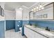 Bathroom with double sinks, marble countertops, and wainscoting at 3061 Penny Ln, Johns Island, SC 29455