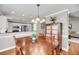 Open dining area with hardwood floors, furniture and views of the kitchen at 3061 Penny Ln, Johns Island, SC 29455