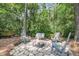 Backyard fire pit area with Adirondack chairs for cozy outdoor gatherings at 3061 Penny Ln, Johns Island, SC 29455