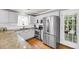 Well-lit kitchen with stainless steel appliances and granite counter tops at 3061 Penny Ln, Johns Island, SC 29455