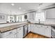 Bright kitchen features stainless steel appliances, granite countertops, and hardwood flooring at 3061 Penny Ln, Johns Island, SC 29455