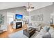 Bright living room featuring hardwood floors, fireplace, and an open layout at 3061 Penny Ln, Johns Island, SC 29455