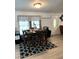 Charming dining room with a table set for dinner, complemented by a patterned rug and natural light at 307 Glen St, Summerville, SC 29483