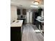 Well-appointed kitchen featuring an island with seating, modern appliances, and stylish finishes at 307 Glen St, Summerville, SC 29483
