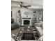 Elegant living room with fireplace, decorative shelves, and comfortable seating arrangement for entertaining at 307 Glen St, Summerville, SC 29483