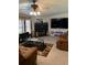 Cozy living room with a brick fireplace, large television, and comfortable seating at 307 Glen St, Summerville, SC 29483