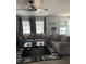 Cozy living room with ceiling fan, neutral-toned couches, and natural light, perfect for relaxing at 307 Glen St, Summerville, SC 29483
