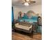 Serene main bedroom featuring a plush bed with elegant headboard and soft lighting creating a tranquil space at 307 Glen St, Summerville, SC 29483