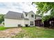 Rear exterior view of house and backyard, including sunroom and grill at 3092 Morningdale Dr, Mount Pleasant, SC 29466