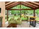 Spacious backyard featuring wooden playset, seating, and lush trees at 3092 Morningdale Dr, Mount Pleasant, SC 29466