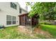 A relaxing screened-in porch in a grassy backyard with a beautiful garden at 3092 Morningdale Dr, Mount Pleasant, SC 29466