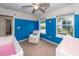 Brightly painted bedroom featuring two large windows, a daybed, and a crib at 3092 Morningdale Dr, Mount Pleasant, SC 29466