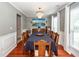 Well-lit dining room features hardwood floors, chair rail molding, and chandelier at 3092 Morningdale Dr, Mount Pleasant, SC 29466
