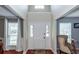 Bright foyer with hardwood floors, a high ceiling, and sidelights flanking the front door, creating a welcoming entrance at 3092 Morningdale Dr, Mount Pleasant, SC 29466