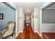 Inviting hallway with wood floors, neutral walls, and a view of the front door and adjacent rooms at 3092 Morningdale Dr, Mount Pleasant, SC 29466