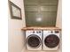 Laundry room with white front-loading washer and dryer at 3092 Morningdale Dr, Mount Pleasant, SC 29466