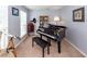 Cozy room with a piano, telescope, and vintage decor, offering a unique and inviting atmosphere at 3092 Morningdale Dr, Mount Pleasant, SC 29466