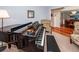 Cozy living space with a grand piano, floral chair, and view into the dining room, providing a comfortable atmosphere at 3092 Morningdale Dr, Mount Pleasant, SC 29466