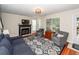 Cozy living room with fireplace, plush seating, and hardwood floors at 3092 Morningdale Dr, Mount Pleasant, SC 29466