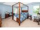 Spacious main bedroom with a four-poster bed and ample natural light at 3092 Morningdale Dr, Mount Pleasant, SC 29466