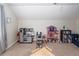 Spacious playroom featuring pretend play kitchen, dollhouse, and reading corner at 3092 Morningdale Dr, Mount Pleasant, SC 29466
