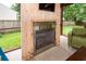 Cozy sunroom fireplace with wooden surround and outdoor view at 3092 Morningdale Dr, Mount Pleasant, SC 29466