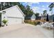 Spacious backyard showcasing a detached garage, fire pit, lush lawn, and outdoor seating for relaxation at 3203 Moonlight Dr, Charleston, SC 29414