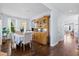Bright dining room showcasing hardwood floors, a vintage hutch, and ample space for entertaining at 3203 Moonlight Dr, Charleston, SC 29414