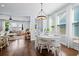 Inviting dining area with hardwood floors, natural light, and an open layout connecting to the living room at 3203 Moonlight Dr, Charleston, SC 29414