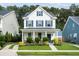 Inviting two-story home with a covered front porch, landscaped garden, and charming curb appeal at 3203 Moonlight Dr, Charleston, SC 29414