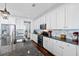 Bright kitchen features stainless appliances, a large sink, and white shaker cabinets at 3203 Moonlight Dr, Charleston, SC 29414