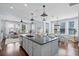 Kitchen featuring large island with seating, open to the living and dining areas at 3203 Moonlight Dr, Charleston, SC 29414