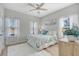 Cozy bedroom featuring natural light, ceiling fan, and hardwood floors at 3278 Great Egret Dr, Johns Island, SC 29455