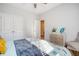 Bright bedroom featuring a bed with patterned bedding, light gray walls, and double door closet at 3278 Great Egret Dr, Johns Island, SC 29455