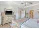 Bedroom showcasing dresser, a flat screen TV, and access to adjoining rooms at 3278 Great Egret Dr, Johns Island, SC 29455