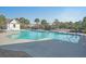 Community pool with lounge chairs and a nearby pool house, surrounded by palm trees and landscaping at 3278 Great Egret Dr, Johns Island, SC 29455