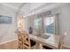 Light dining area with natural wood table, seating for six, and light fixture at 3278 Great Egret Dr, Johns Island, SC 29455