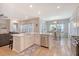 Modern kitchen with stainless steel appliances, white cabinets, and a large center island at 3278 Great Egret Dr, Johns Island, SC 29455