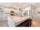 Stylish kitchen with stainless steel appliances, white cabinets, and a large center island with seating at 3278 Great Egret Dr, Johns Island, SC 29455