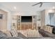 Relaxing living room features a large sectional sofa, entertainment center, and decorative accents at 3278 Great Egret Dr, Johns Island, SC 29455