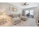 Living area featuring a comfortable sectional sofa and natural light from a window at 3278 Great Egret Dr, Johns Island, SC 29455